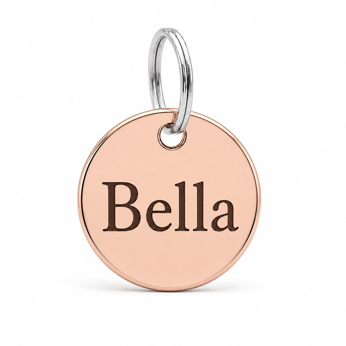 Ronde hondenpenning met naam in rosé goud, gegraveerd met de hondennaam Bella